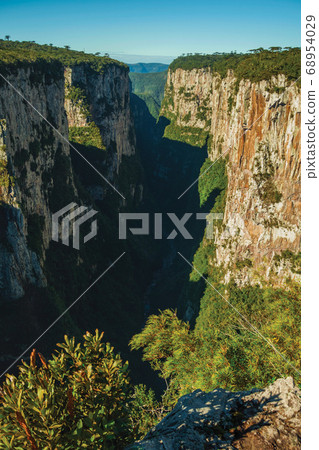 Itaimbezinho Canyon with steep rocky cliffs Itaimbezinho Canyon with steep rocky cliffs 68954029