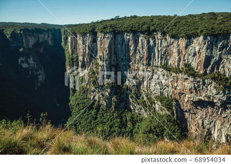 Itaimbezinho Canyon with steep rocky cliffs Itaimbezinho Canyon with steep rocky cliffs 68954034