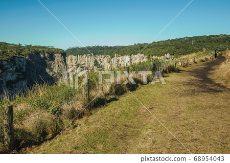 People on dirt pathway at the Itaimbezinho Canyon People on dirt pathway at the Itaimbezinho Canyon 68954043