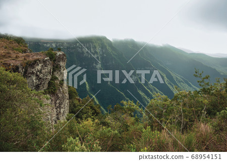 Fortaleza Canyon with rocky cliffs on foggy day Fortaleza Canyon with rocky cliffs on foggy day 68954151