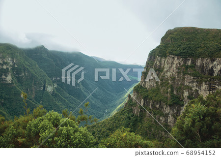 Fortaleza Canyon with rocky cliffs on foggy day 68954152