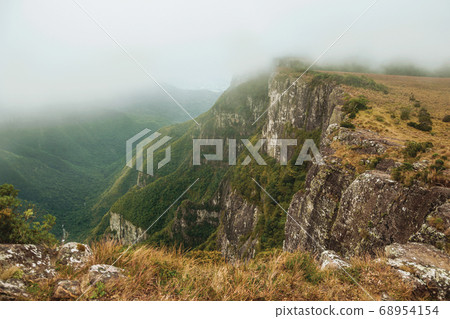 Fortaleza Canyon with rocky cliffs on foggy day 68954154