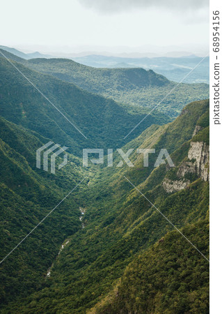 Fortaleza Canyon with rocky cliffs on foggy day 68954156