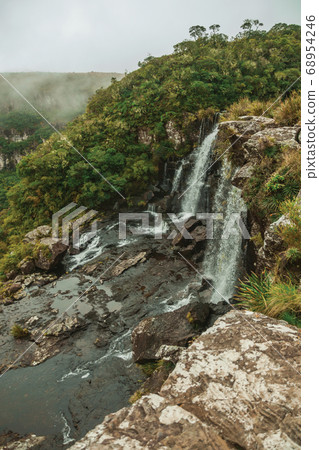 Black Tiger Waterfall on cliff with mist 68954246