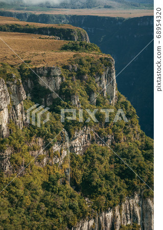 Fortaleza Canyon with steep cliffs and waterfall Fortaleza Canyon with steep cliffs and waterfall 68954320