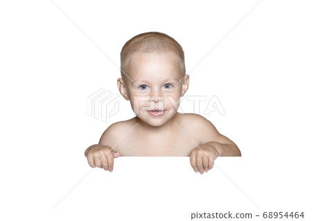 little child behind white board. Cute boy holding white board and looking in camera, isolated on white little child behind white board. Cute boy holding white board and looking in camera, isolated on white 68954464