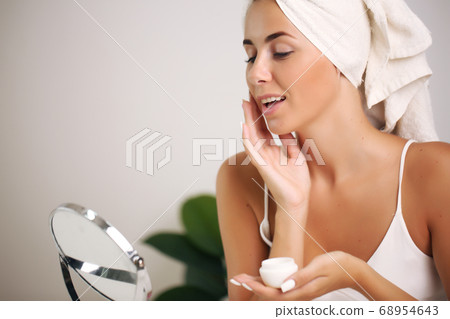 Beautiful spa girl. Touching her face. beauty and health Beautiful spa girl. Touching her face. beauty and health 68954643