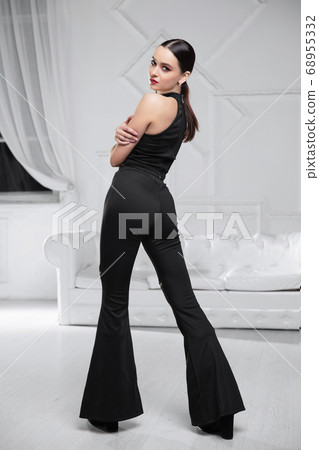 Pretty brunette dressed in a black Pretty brunette dressed in a black 68955332