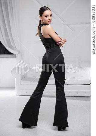 Lovely brunette dressed in a black Lovely brunette dressed in a black 68955333