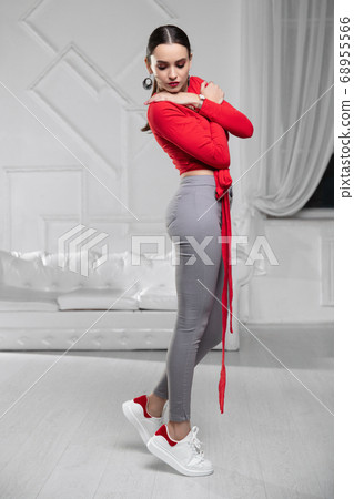 Attractive lady dressed in a red blouse 68955566