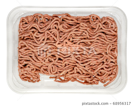 Vegan ground meat in a plastic tray. Substitute for minced meat based on pea protein, with onions and spices. Meat alternative. Close-up, from above, isolated on white background, macro food photo. Vegan ground meat in a plastic tray. Substitute for minced meat based on pea protein, with onions and spices. Meat alternative. Close-up, from above, isolated on white background, macro food photo. 68956317