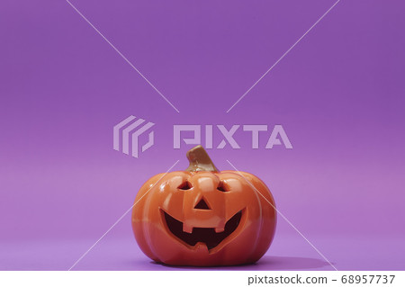 Pumpkin on a violet background, Halloween 68957737