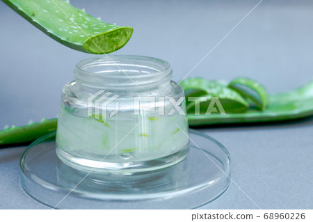 Aloe vera gel and aloe vera star cactus slide Isolated on gray background Aloe vera gel and aloe vera star cactus slide Isolated on gray background 68960226