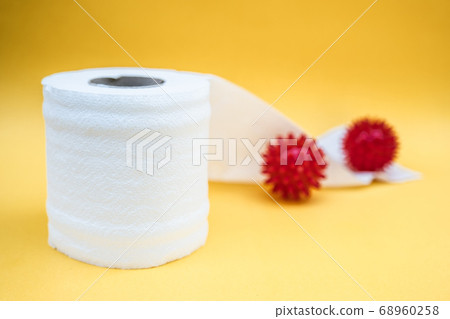 Toilet paper isolated on a yellow background Toilet paper isolated on a yellow background 68960258