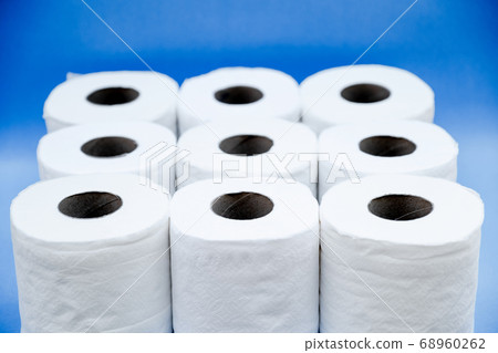 Toilet paper isolated on a blue background Toilet paper isolated on a blue background 68960262