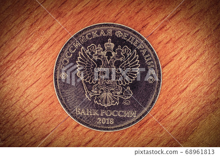 Modern russian coin revers with seal of Bank of Russia depicting twin headed eagle with heraldic signs Modern russian coin revers with seal of Bank of Russia depicting twin headed eagle with heraldic signs 68961813