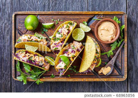 salmon tacos with spicy red cabbage salad 68963856