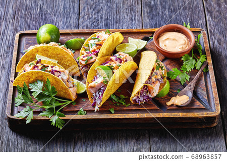 fish tacos with shredded red cabbage salad 68963857