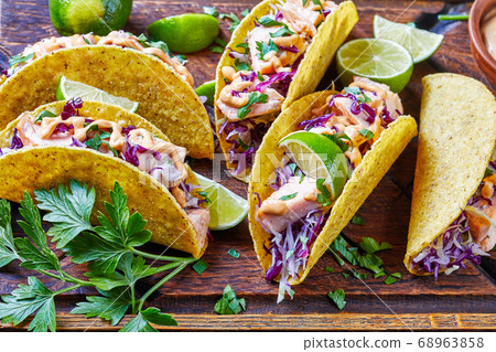 salmon tacos with shredded red cabbage salad 68963858