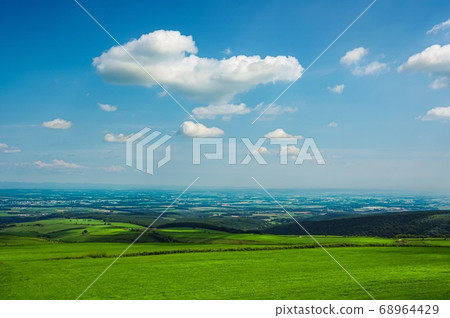 The Tokachi plain seen from the Naitai Kogen Farm (Kamishihoro Town, Hokkaido) 68964429