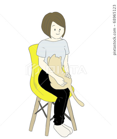 Young woman sitting on a chair and stroking a cat and a cat spoiled on her knees 68965123