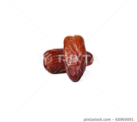 Palm dates on the white background Palm dates on the white background 68969891