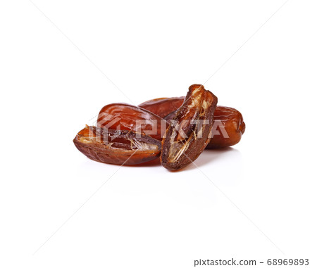 Palm dates on the white background Palm dates on the white background 68969893