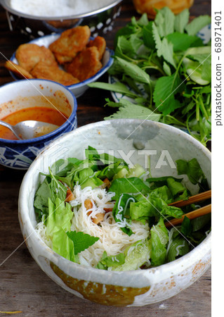vietnamese vegan meal for breakfast, noodles bowl with fried mushroom pies, salad, simple vegetarian food good for health 68971401