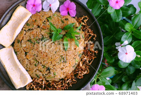 Vietnamese homemade food for lunch time, woman hand hold fried rice, simple vegan food for vegetarian 68971403