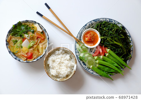 vegan daily meal for lunch time, boiled okra, water spinach, cucumber with tofu cheese, rice bowl, vegetables soup, simple vegetarian healthy diet  68971428