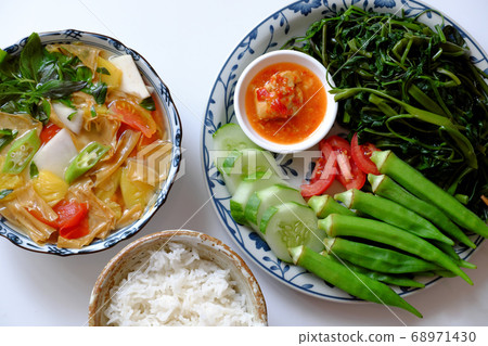 vegan daily meal for lunch time, boiled okra, water spinach, cucumber with tofu cheese, rice bowl, vegetables soup, simple vegetarian healthy diet vegan daily meal for lunch time, boiled okra, water spinach, cucumber with tofu cheese, rice bowl, vegetables soup, simple vegetarian healthy diet 68971430