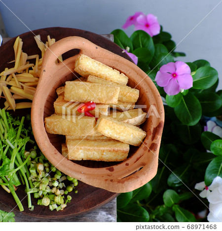 sliced fried tofu with ginger for simple homemade vegan food 68971468