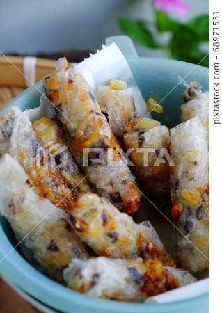 Close up deep fried corn spring rolls, delicious vegan food ready to eat 68971531
