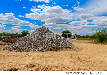 Piles of gravel for road construction Piles of gravel for road construction 68972495