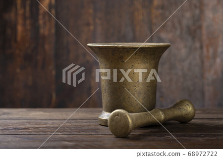brass mortar for chopping herbs or for spices on a 68972722