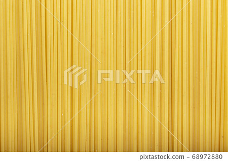 Italian uncooked long spaghetti as background. 68972880