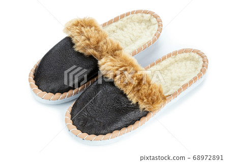 Warm indoor slippers on a white background. Clear 68972891