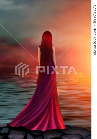 Beautiful girl in a long red dress in the rays of 68973275