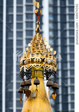 Decorative golden turret in a Buddhist monastery 68974392