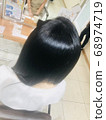 Shiny hair after hair coloring 68974719