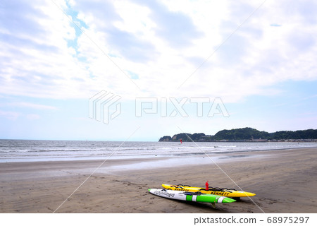 Colorful surfboards placed on the lumber shore Colorful surfboards placed on the lumber shore 68975297