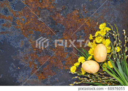 Easter Eggs flower of coltsfoot and branch with Easter Eggs flower of coltsfoot and branch with 68976055