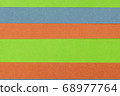 Green, Orange and Blue coloured paper background 68977764