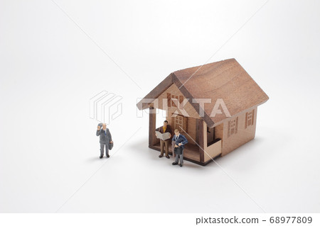 Mini house with figure isolated on white 68977809