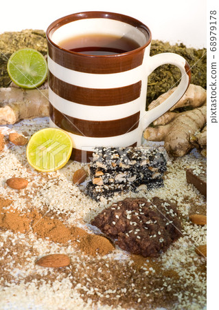 cup of tea with ingredients for tea cup of tea with ingredients for tea 68979178