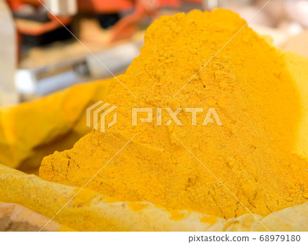 Turmeric powder spice pile 68979180