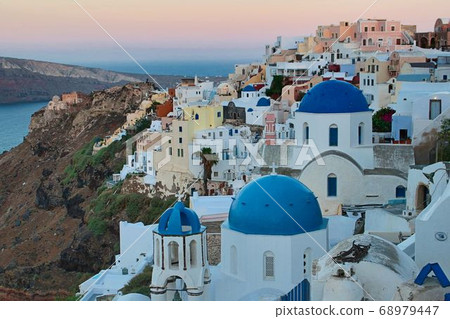 Santorini skyline and church at sunrise Santorini skyline and church at sunrise 68979447
