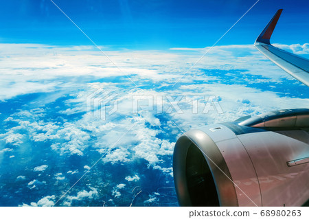 View from an airplane window View from an airplane window 68980263