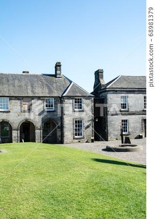 A historic stone building under the clear sky at Sterling Castle in Scotland 68981379