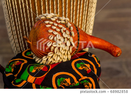 African Ghana Shekere drum (African Percussion instrument from Ghana. Also known as an Axatse) Isolated with blurred background. 68982858